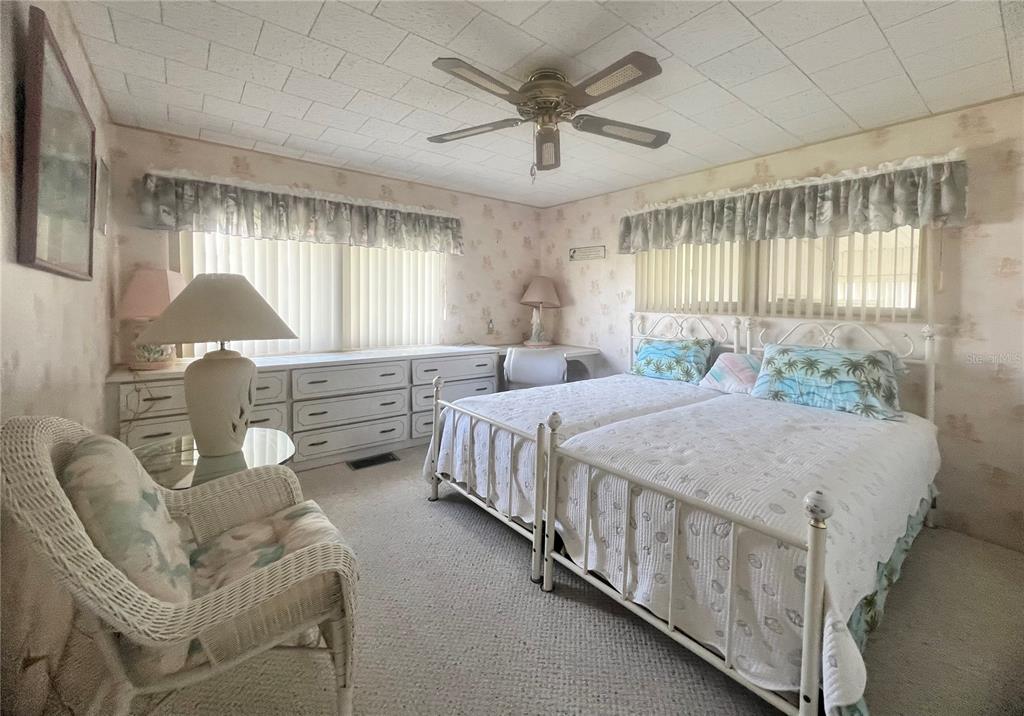 1100 South Belcher Road, Unit 64 Largo, FL 33771 - Photo 19 of 52 a bed room with a bed and a chair