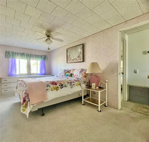 an aerial view of a house with a lake view