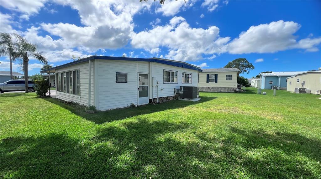 1100 South Belcher Road, Unit 64 Largo, FL 33771 - Photo 25 of 52 a view of a yard in front of a house with a yard