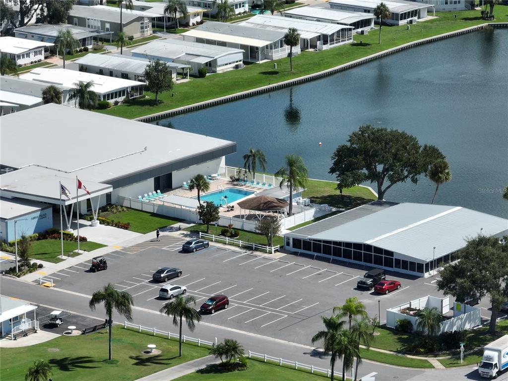 1100 South Belcher Road, Unit 64 Largo, FL 33771 - Photo 31 of 52 an aerial view of a house with garden space and street view