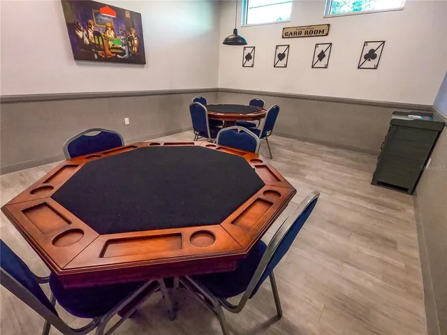 a living room with furniture and a clock