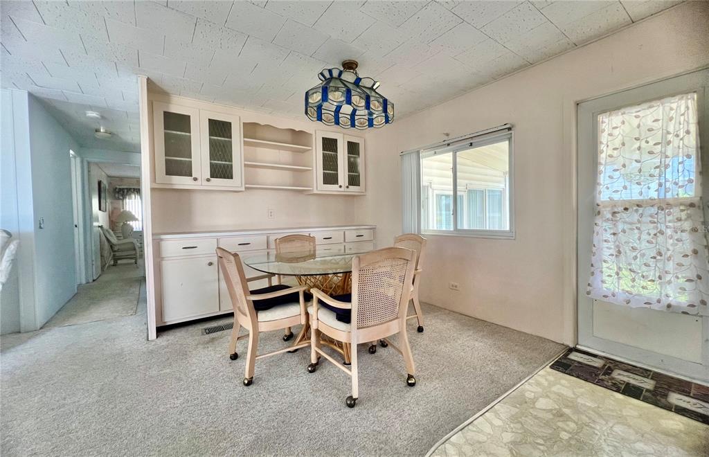 1100 South Belcher Road, Unit 64 Largo, FL 33771 - Photo 9 of 52 a dining room with furniture and window
