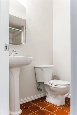 a bathroom with a sink and a toilet