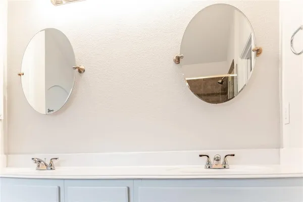 a bathroom with a sink and mirror