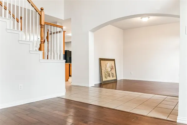 a view of an entryway with wooden floor