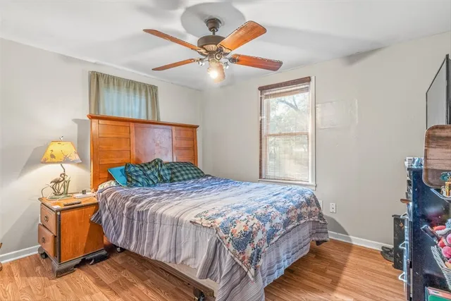 a bedroom with a bed and window