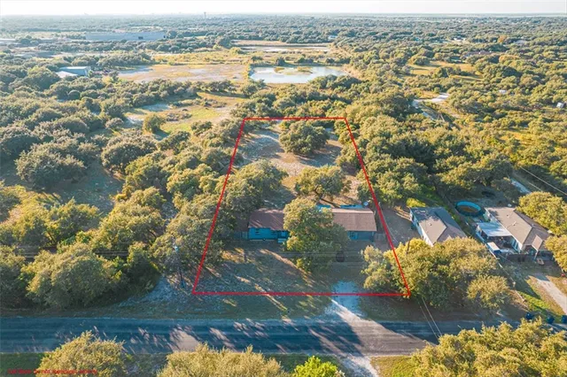an aerial view of residential house with outdoor space and lake view