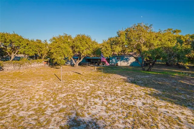 a view of outdoor space with playground and green space