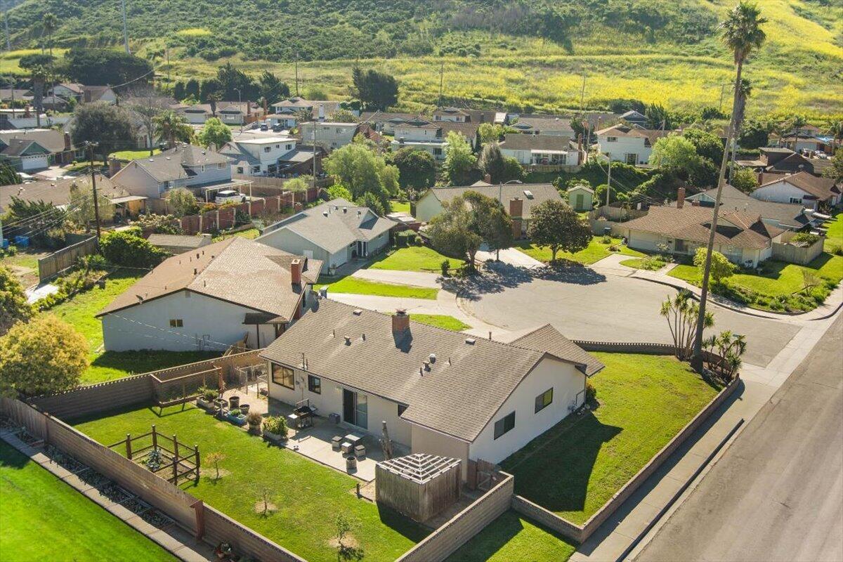 an aerial view of residential houses with outdoor space