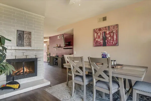 a view of a livingroom with furniture and a fireplace