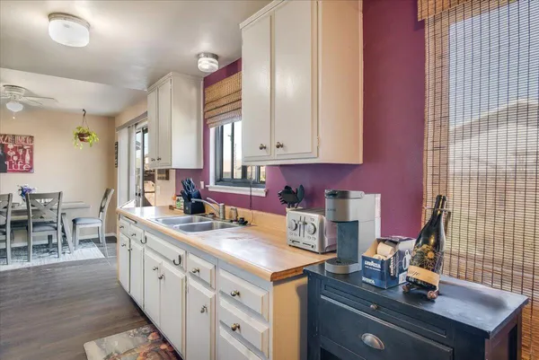 a kitchen with sink cabinets and stove