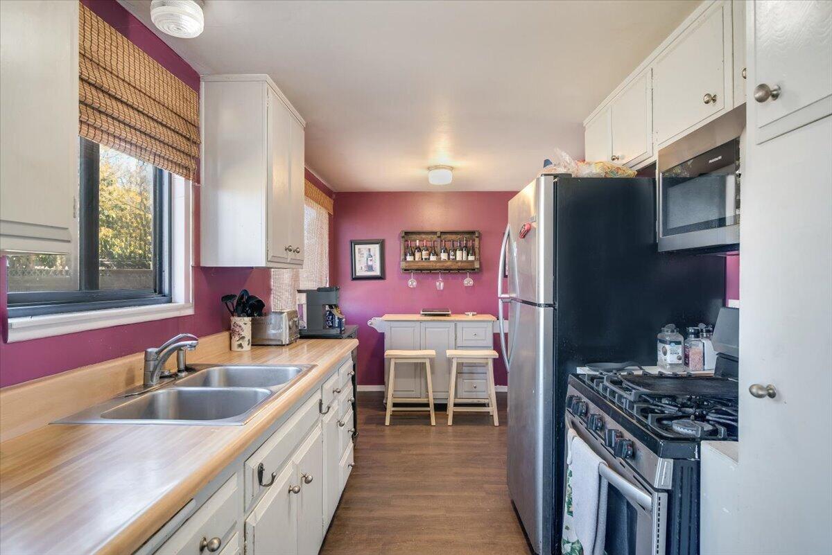 1601 Barrington Court Lompoc, CA 93436 - Photo 17 of 26 a kitchen with a sink stove and refrigerator