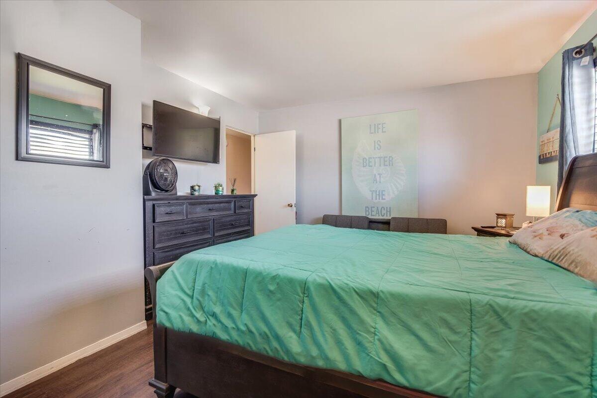 1601 Barrington Court Lompoc, CA 93436 - Photo 19 of 26 a bedroom with a bed window and a flat screen tv