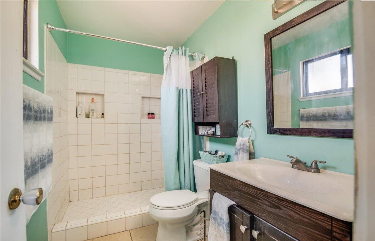 1601 Barrington Court Lompoc, CA 93436 - Photo 21 of 26 a bathroom with a sink toilet and shower