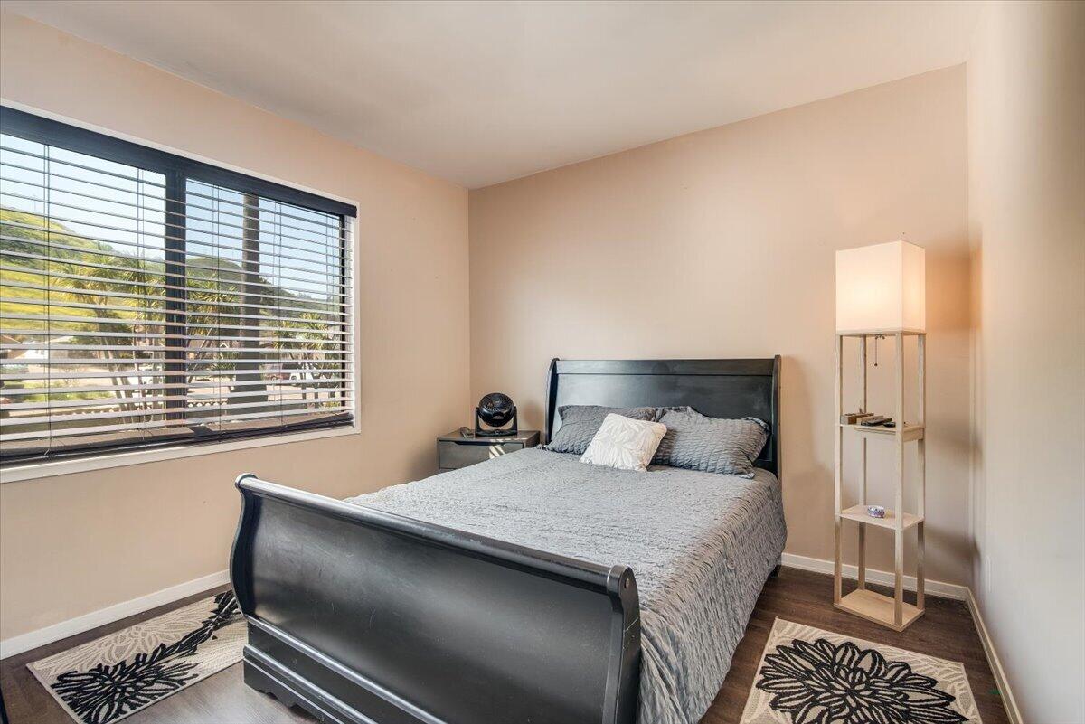 1601 Barrington Court Lompoc, CA 93436 - Photo 23 of 26 a bedroom with a bed and a lamp next to a window