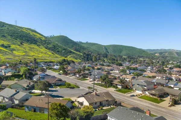 an aerial view of residential houses with outdoor space