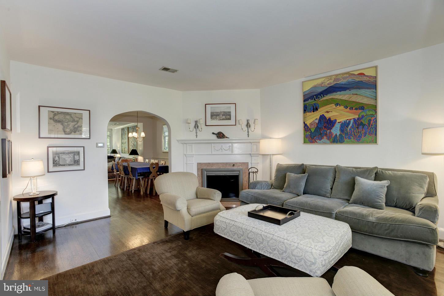 3813 T Street Northwest Washington, DC 20007 - Photo 3 of 24 a living room with furniture a rug and a fireplace