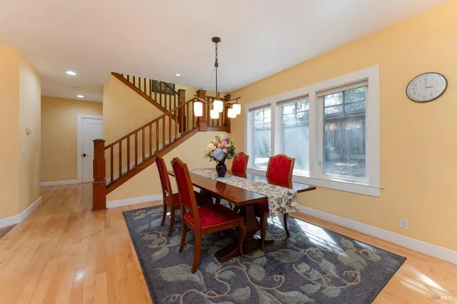 a dining room with furniture and window