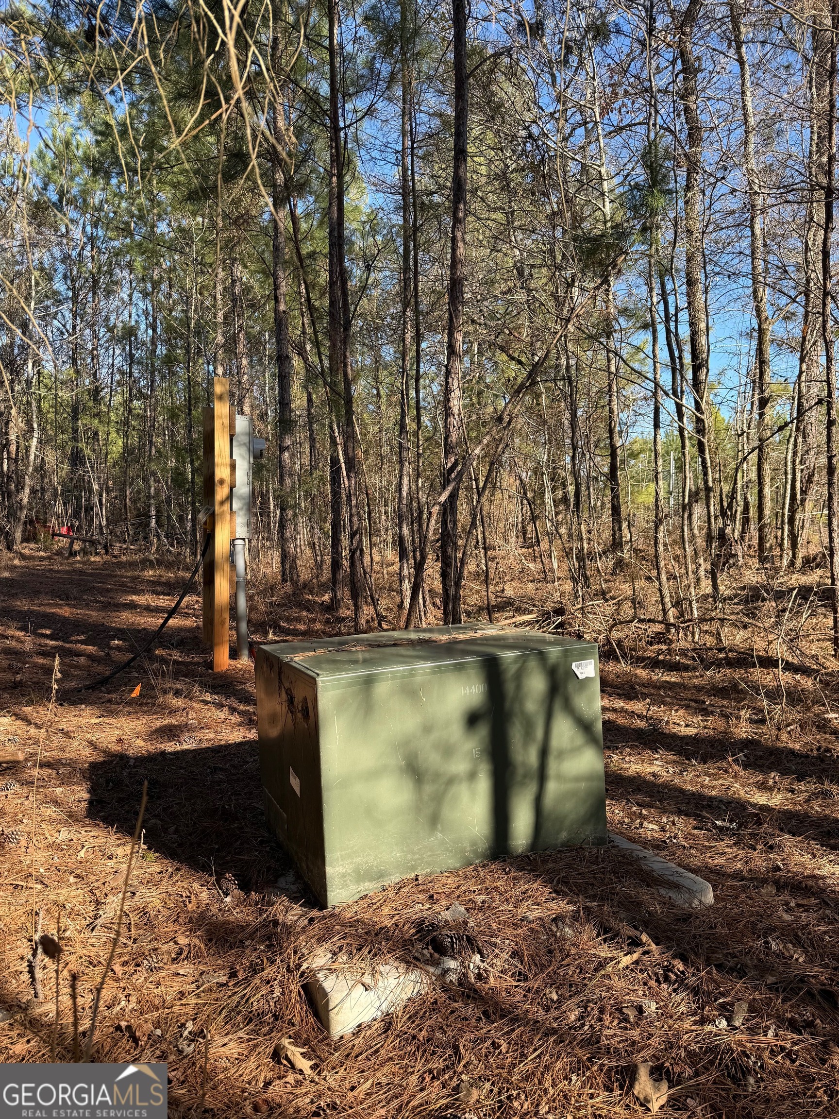 641 Dennis Station Road Southwest Eatonton, GA 31024 - Photo 12 of 13 a view of a yard with wooden fence