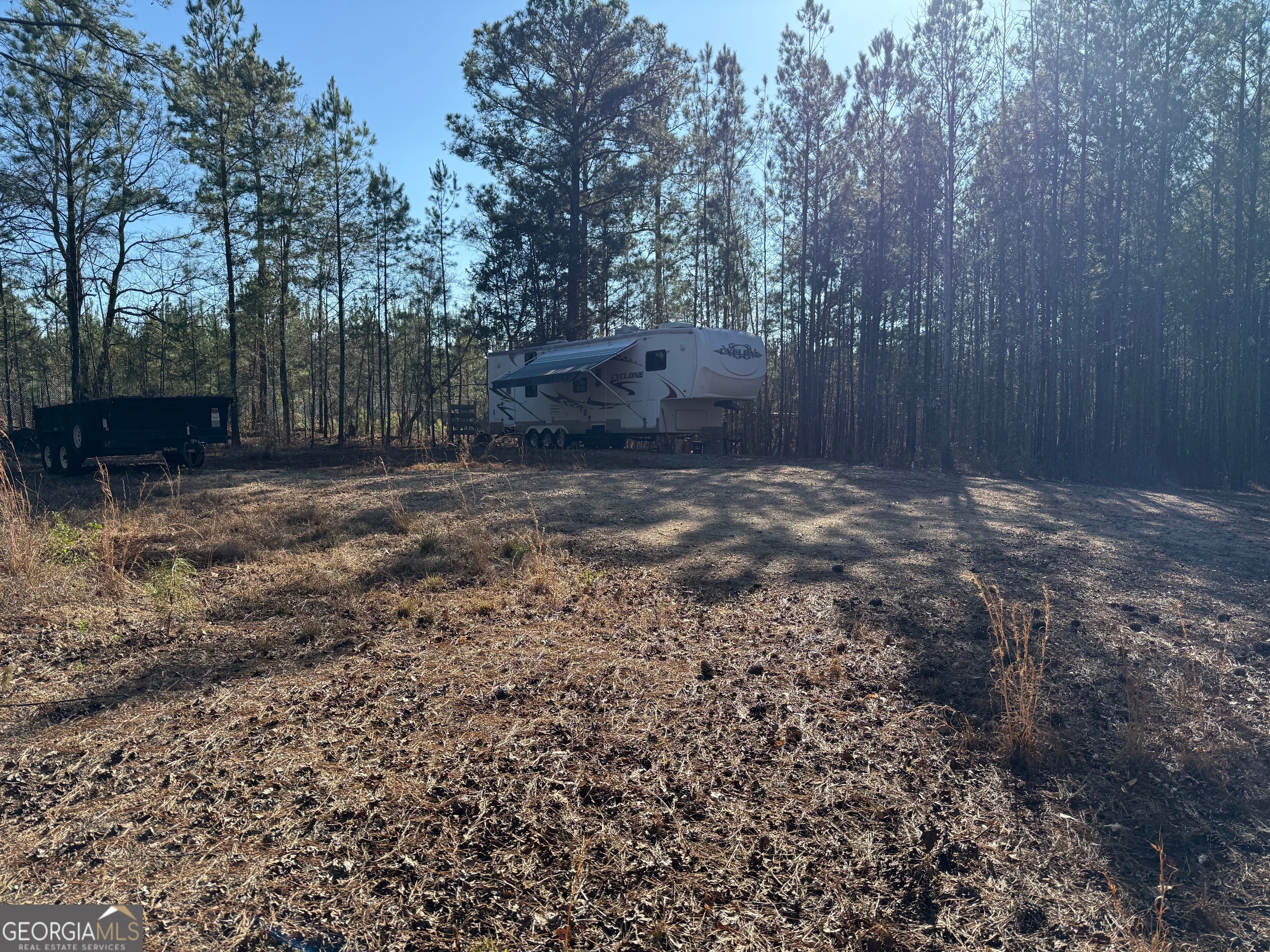641 Dennis Station Road Southwest Eatonton, GA 31024 - Photo 9 of 13 a backyard of a house with lots of green space