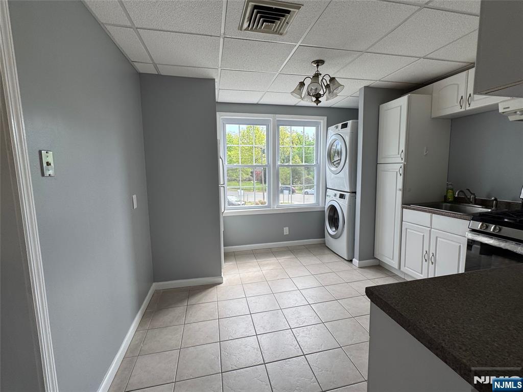 196-rock Rock Road, Unit 2A Glen Rock, NJ 07452 - Photo 14 of 26 a kitchen with a refrigerator and a stove top oven