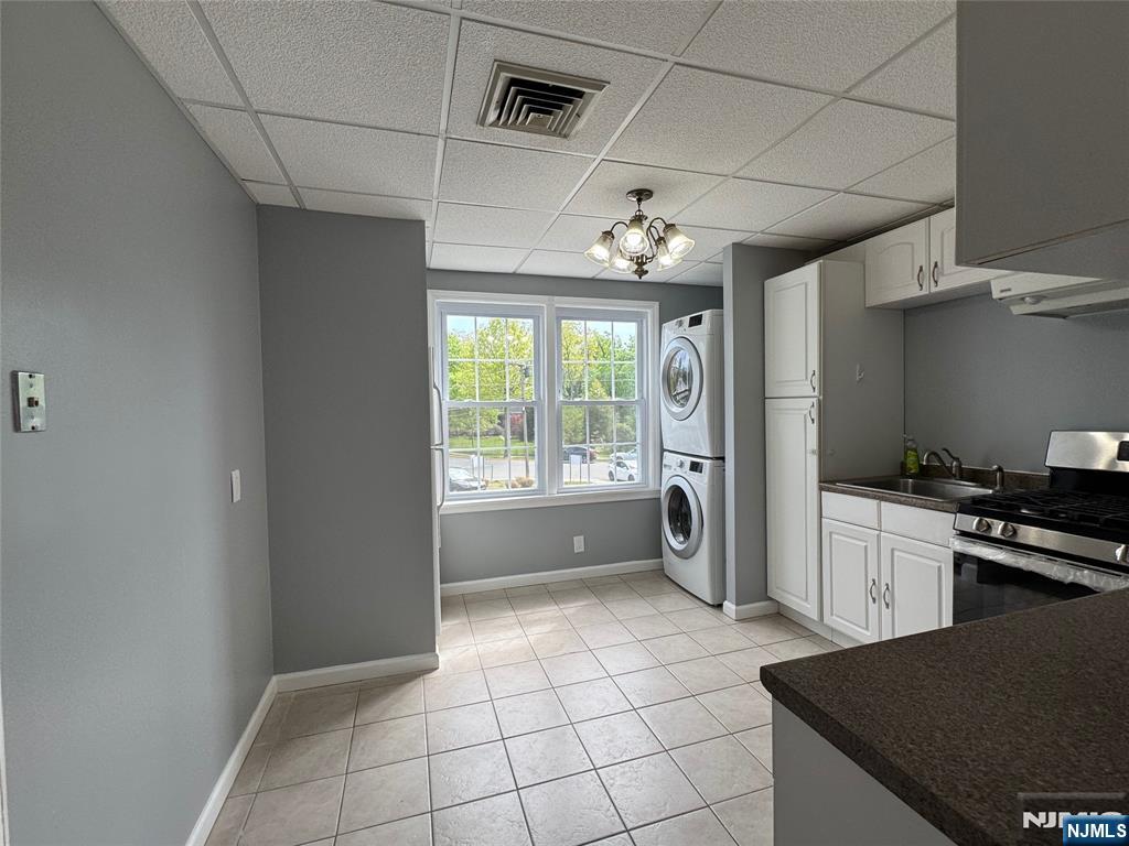 196-rock Rock Road, Unit 2A Glen Rock, NJ 07452 - Photo 15 of 26 a kitchen with a stove a sink and a refrigerator