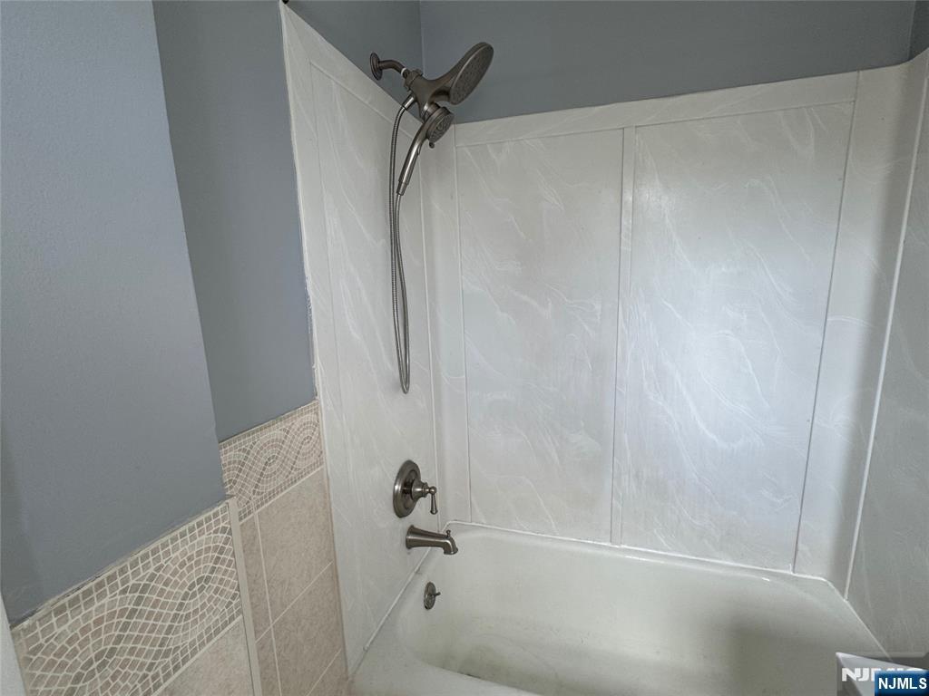 196-rock Rock Road, Unit 2A Glen Rock, NJ 07452 - Photo 23 of 26 a bathroom with a bathtub