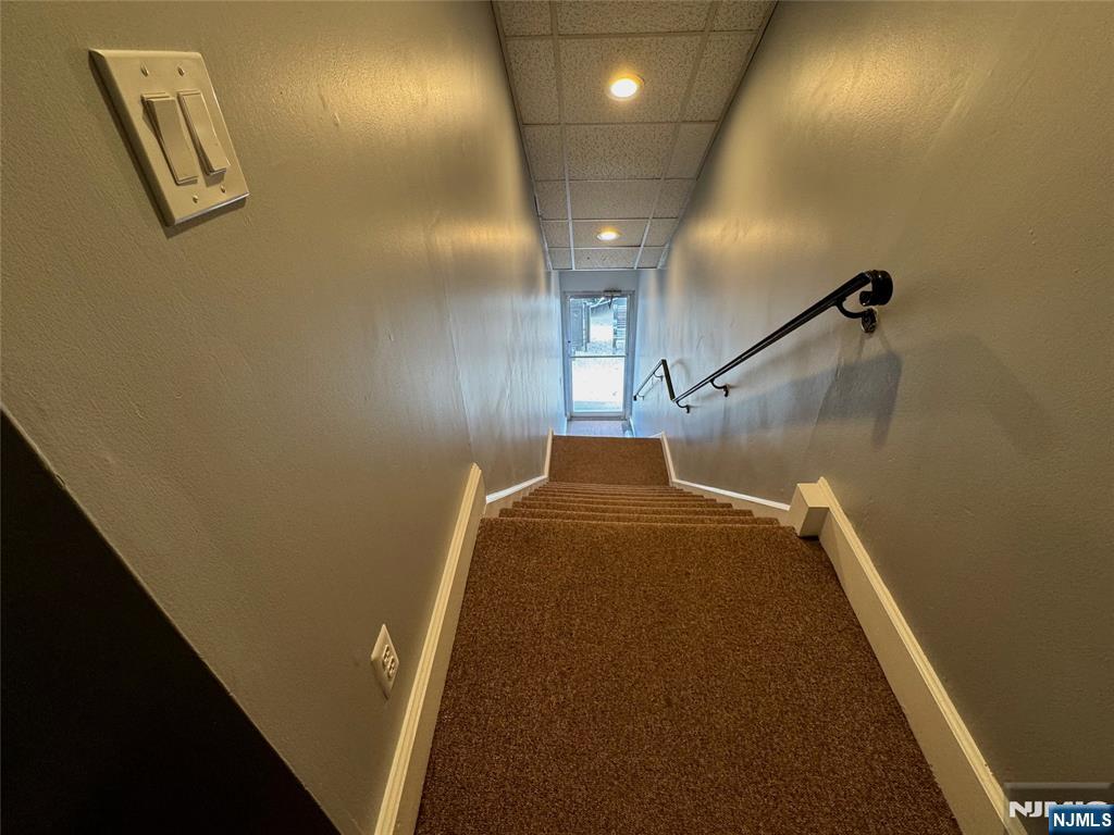 196-rock Rock Road, Unit 2A Glen Rock, NJ 07452 - Photo 26 of 26 a view of a hallway with paintings on the wall