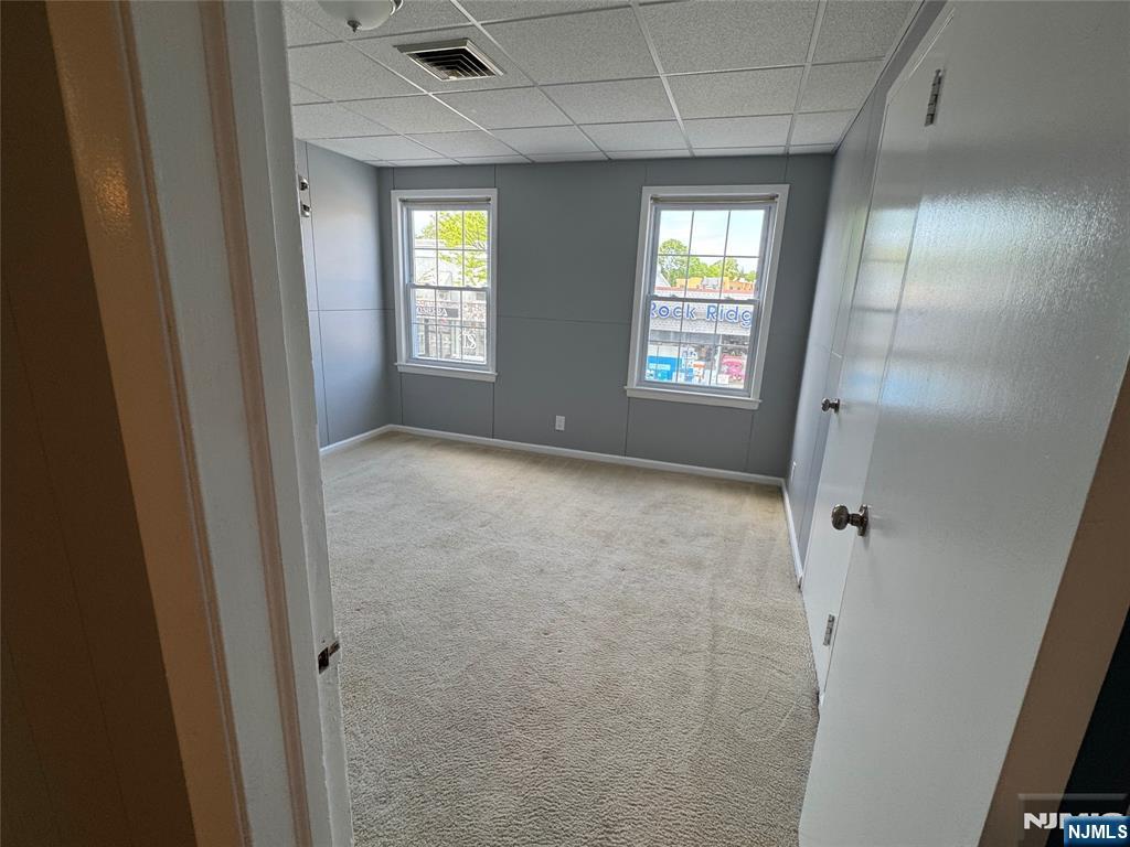 196-rock Rock Road, Unit 2A Glen Rock, NJ 07452 - Photo 9 of 26 a view of an empty room with two window