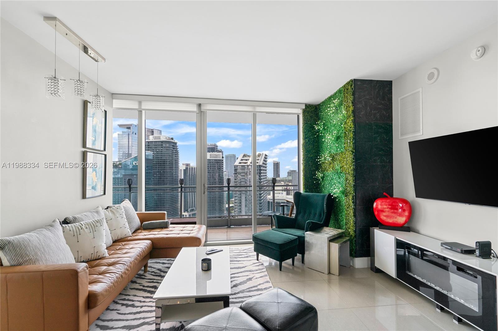 a living room with furniture and a flat screen tv