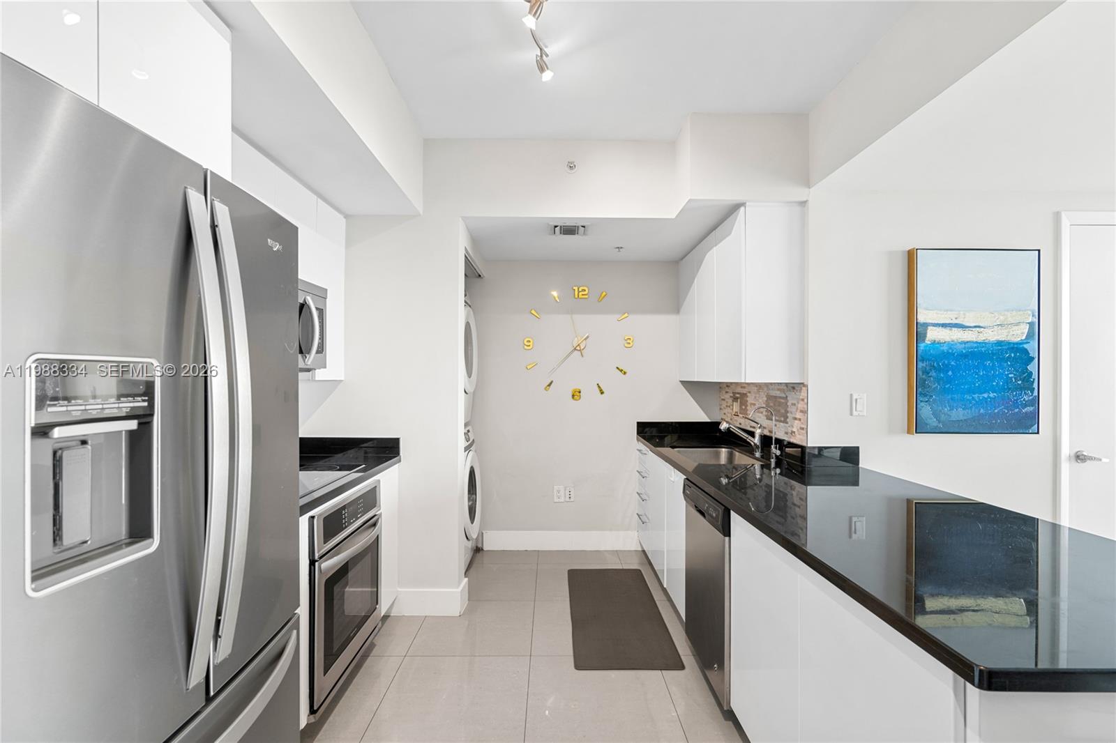 92 Southwest 3rd Street, Unit 4702 Miami, FL 33130 - Photo 12 of 47 a kitchen with stainless steel appliances a refrigerator sink and stove