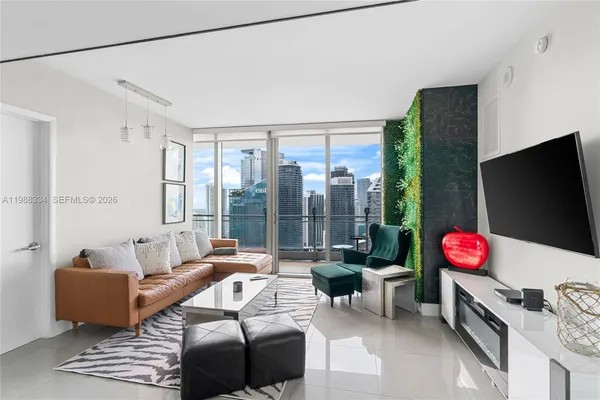 a living room with furniture and a flat screen tv