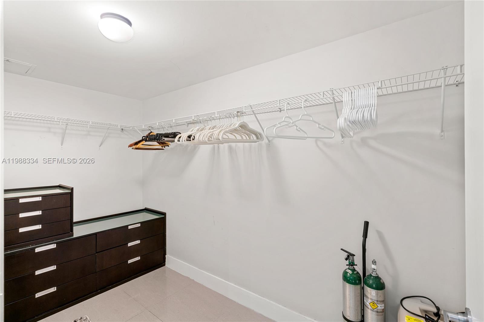 92 Southwest 3rd Street, Unit 4702 Miami, FL 33130 - Photo 23 of 47 a room with a window and a potted plant