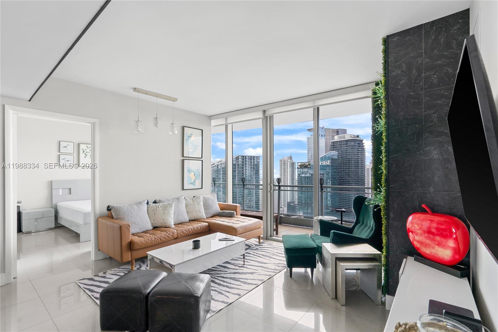 92 Southwest 3rd Street, Unit 4702 Miami, FL 33130 - Photo 3 of 47 a bedroom with a bed and glass window