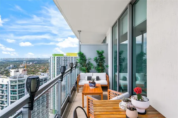 a view of a balcony with wooden floor