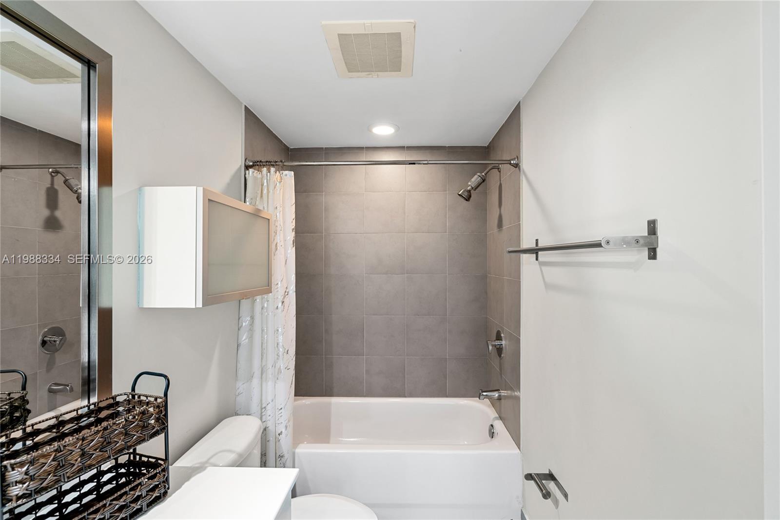 92 Southwest 3rd Street, Unit 4702 Miami, FL 33130 - Photo 43 of 47 a bathroom with a bathtub and a shower