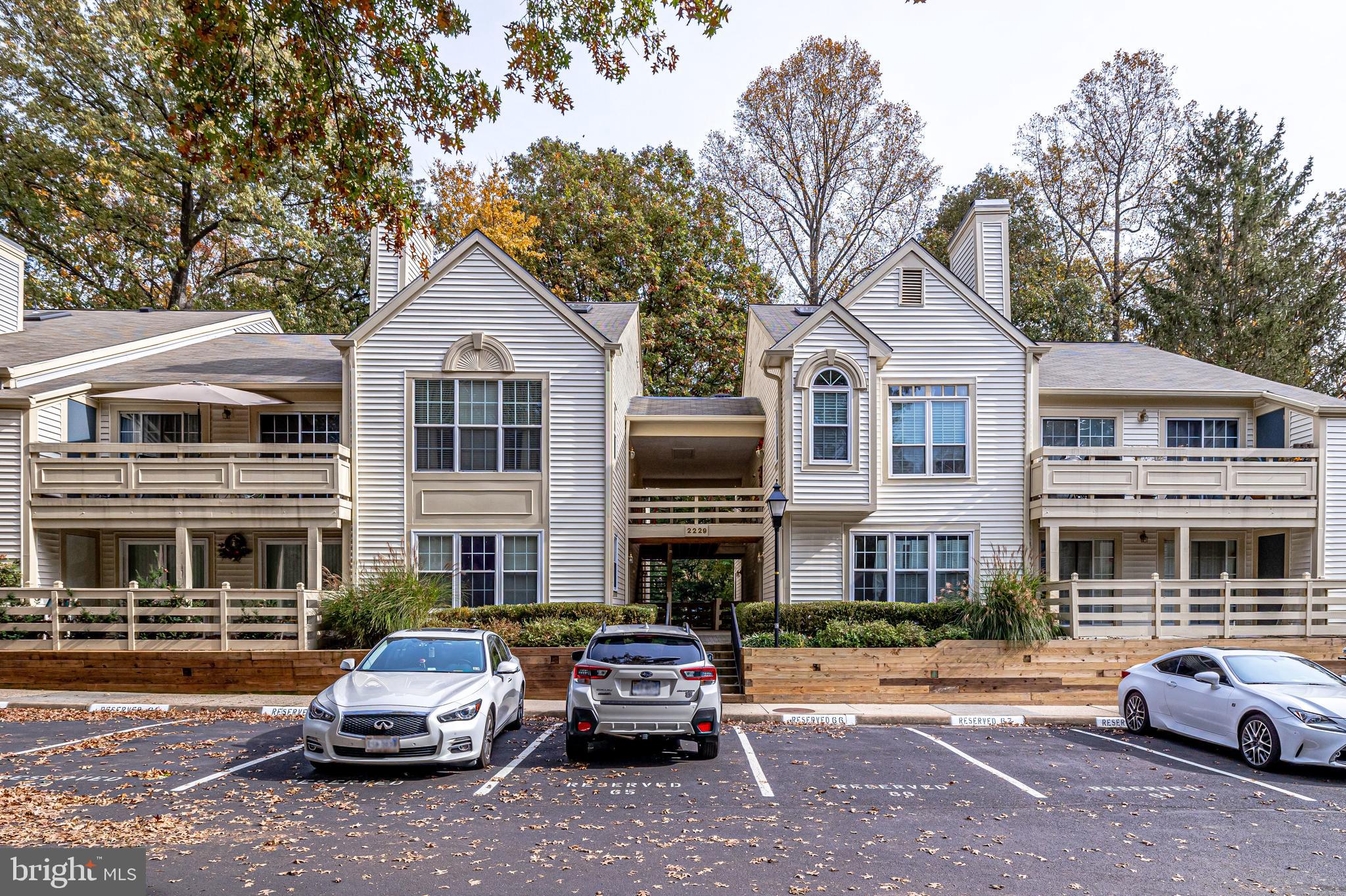 2229 Lovedale Lane, Unit G Reston, VA 20191 - Photo 1 of 38 a car parked in front of a house