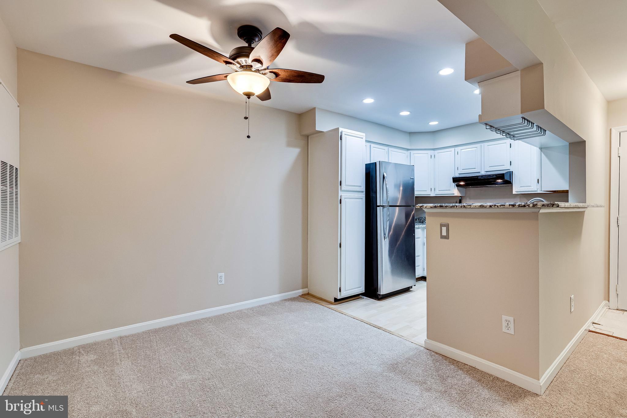 2229 Lovedale Lane, Unit G Reston, VA 20191 - Photo 11 of 38 a view of a kitchen with a sink and a refrigerator