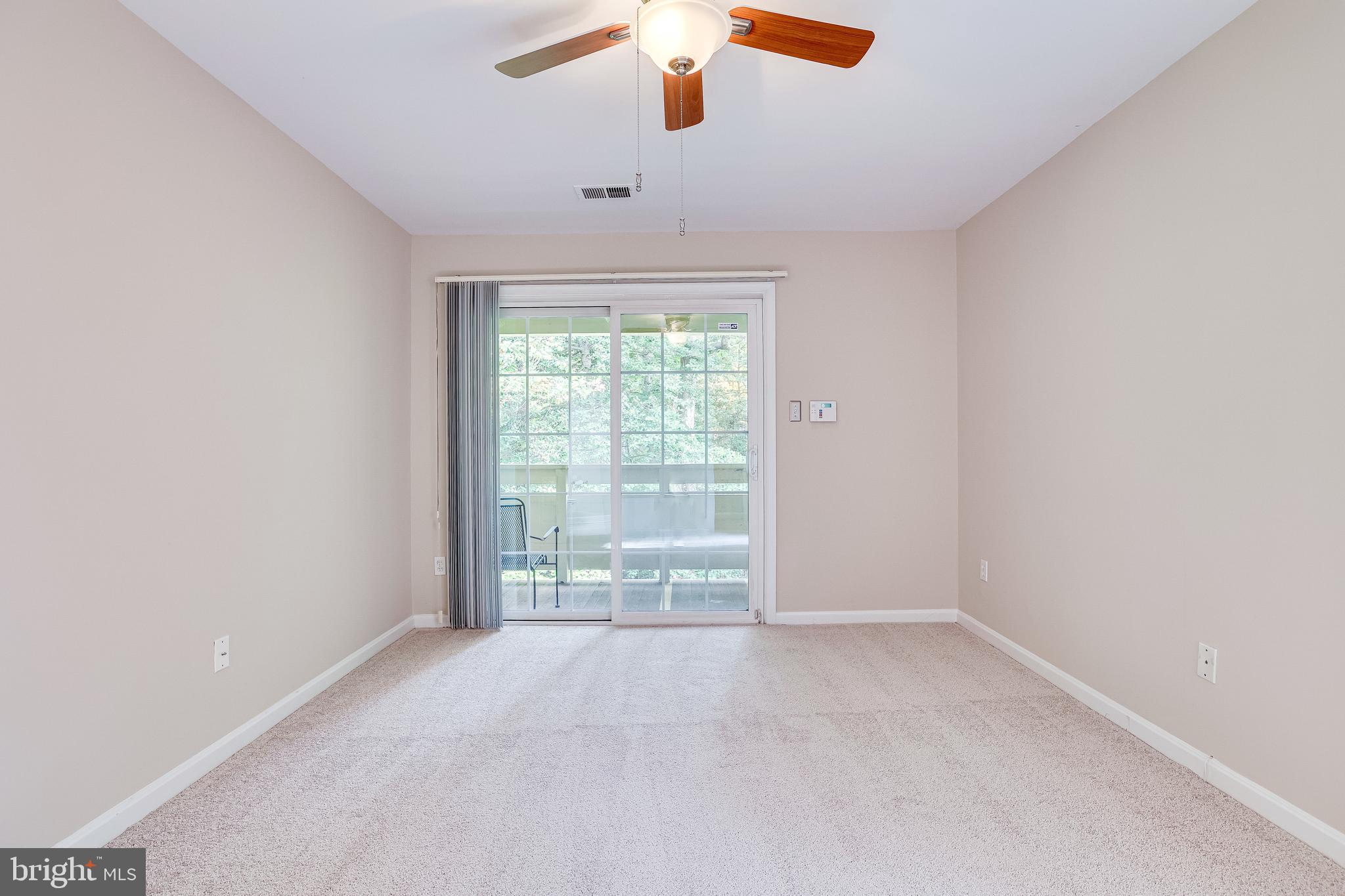 2229 Lovedale Lane, Unit G Reston, VA 20191 - Photo 18 of 38 wooden floor in an empty room with a window