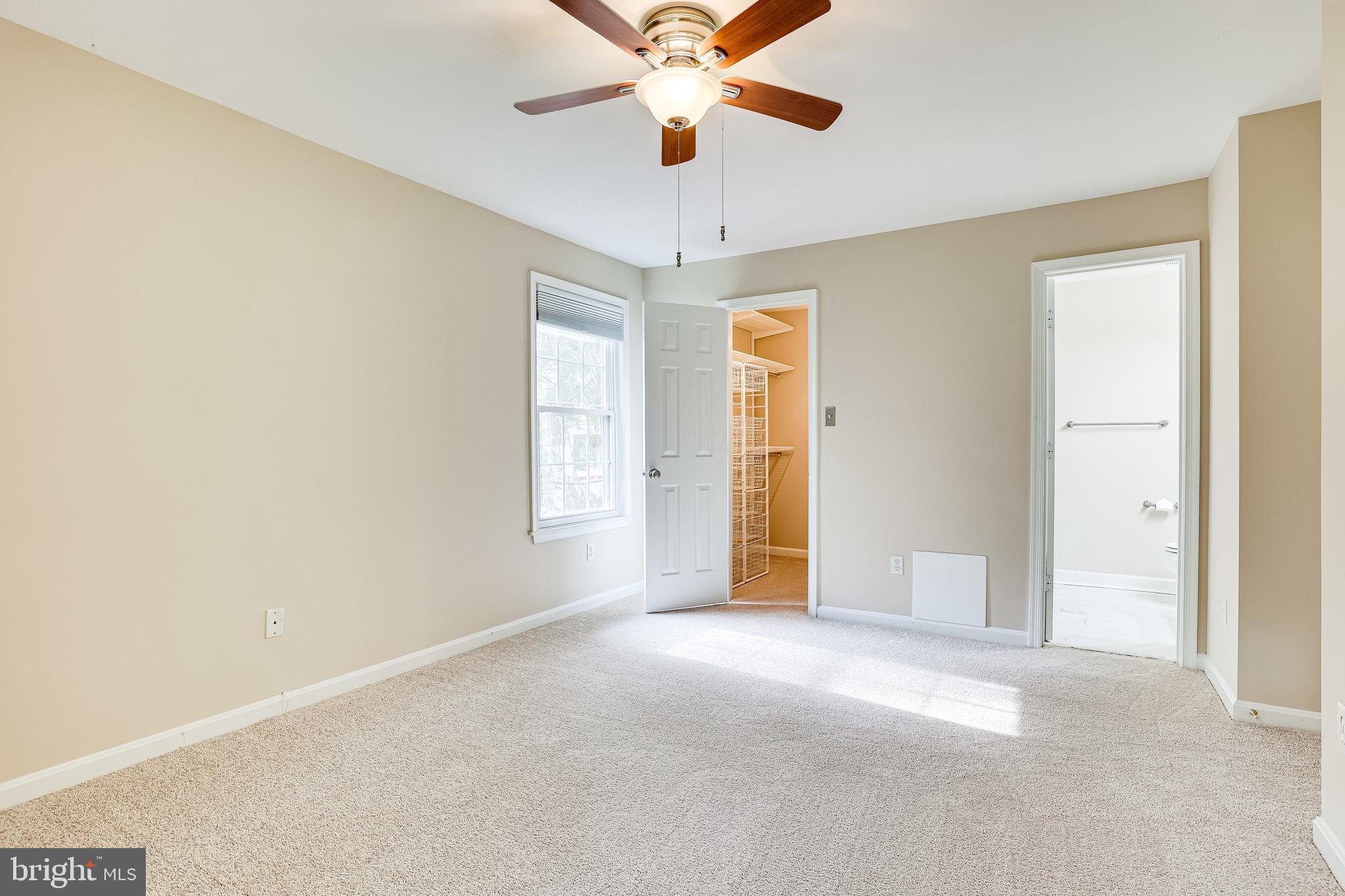 2229 Lovedale Lane, Unit G Reston, VA 20191 - Photo 19 of 38 a view of a livingroom with a ceiling fan and window