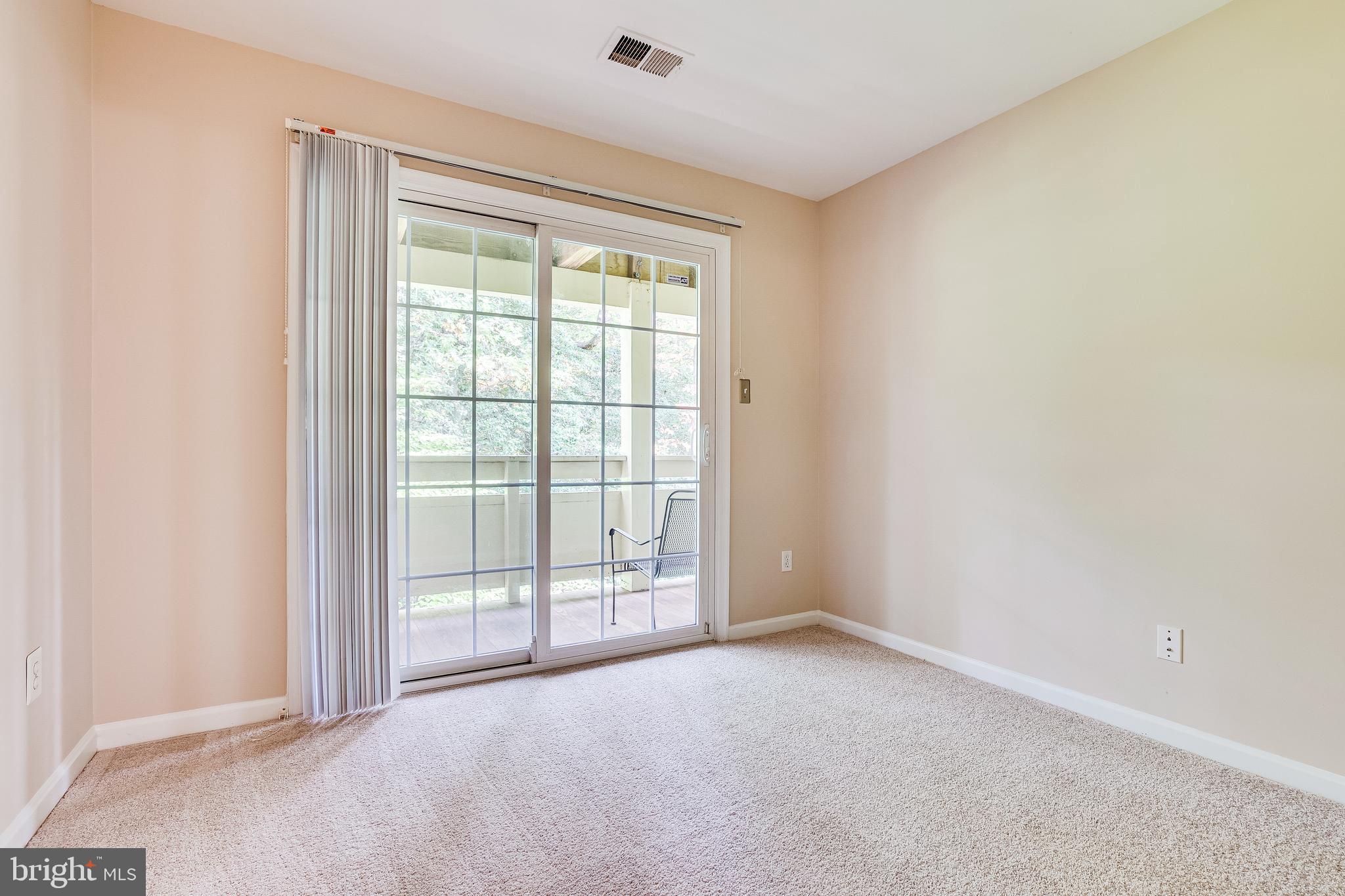 2229 Lovedale Lane, Unit G Reston, VA 20191 - Photo 23 of 38 a view of an empty room with a window