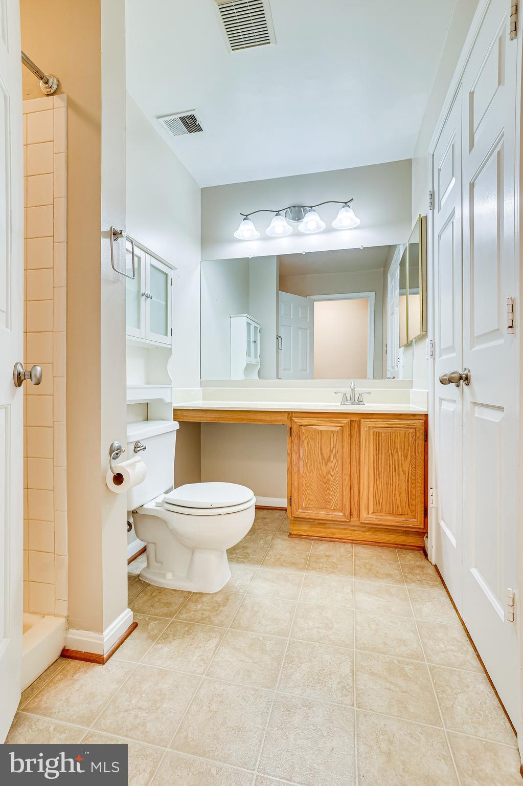 2229 Lovedale Lane, Unit G Reston, VA 20191 - Photo 25 of 38 a bathroom with a toilet a sink and shower