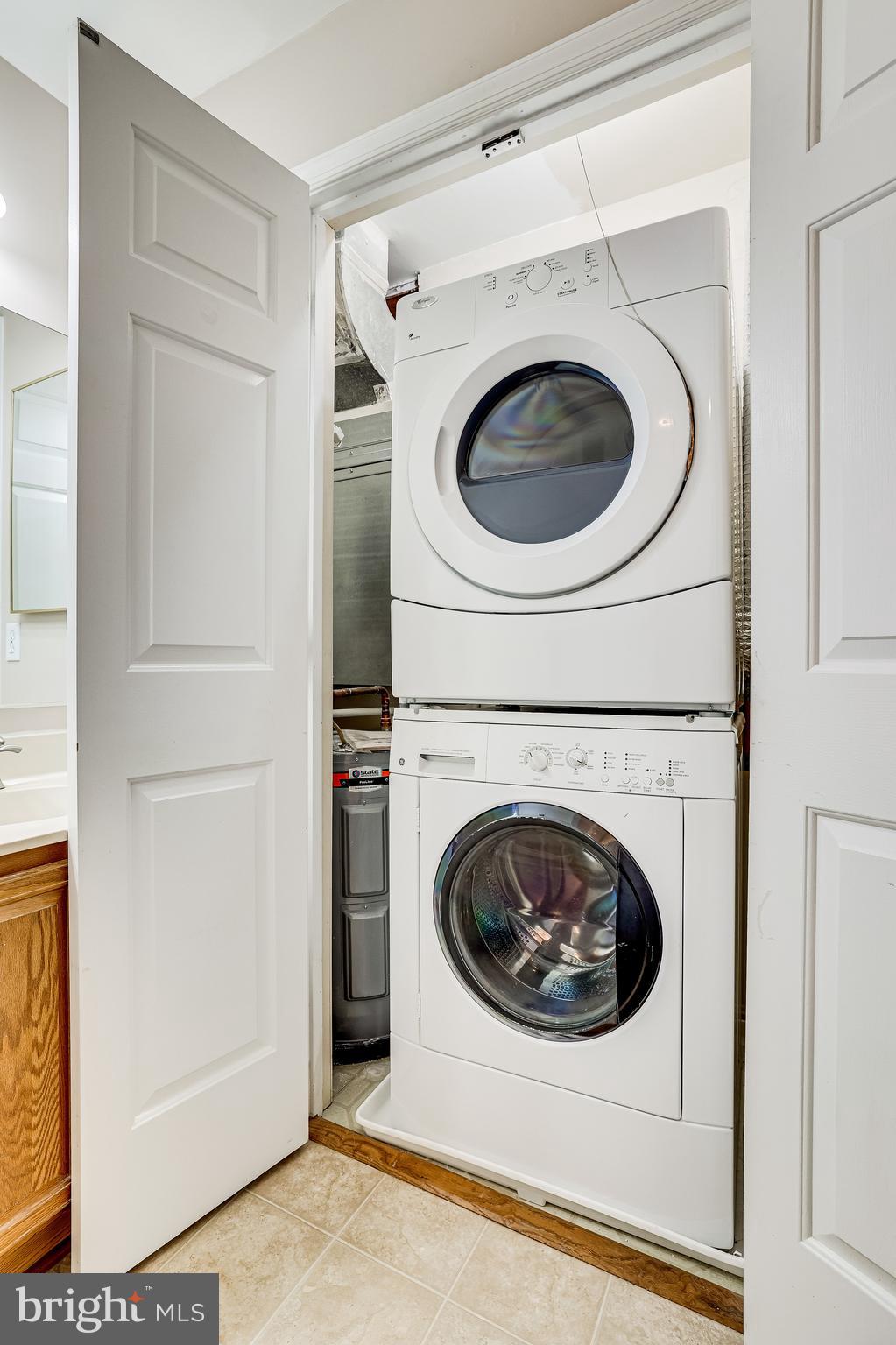 2229 Lovedale Lane, Unit G Reston, VA 20191 - Photo 28 of 38 a utility room with dryer and washer