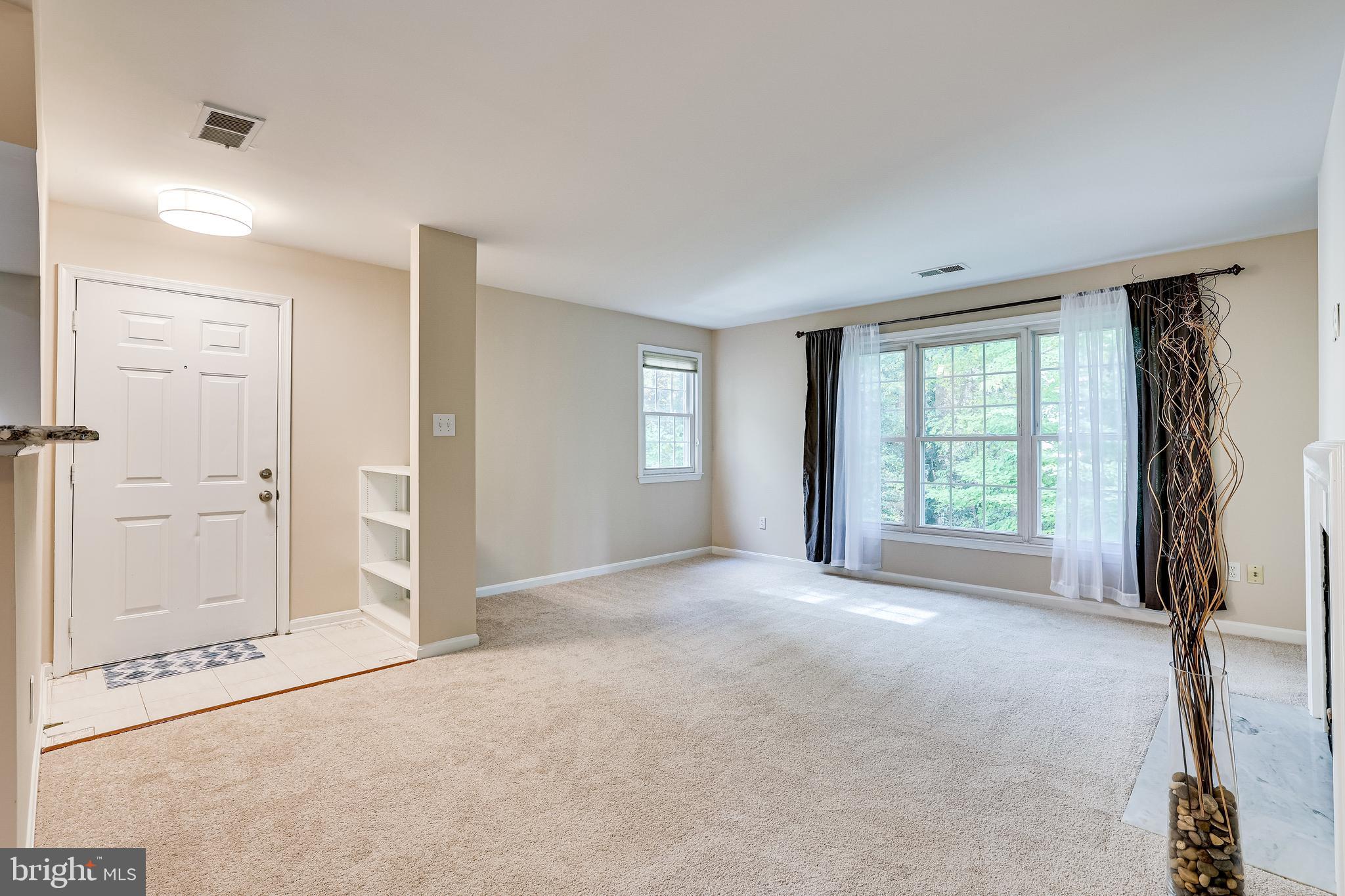 2229 Lovedale Lane, Unit G Reston, VA 20191 - Photo 8 of 38 an empty room with windows