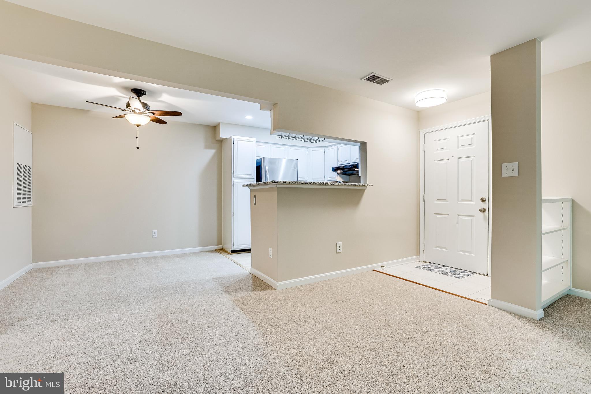 2229 Lovedale Lane, Unit G Reston, VA 20191 - Photo 10 of 38 a view of an empty room with a ceiling fan