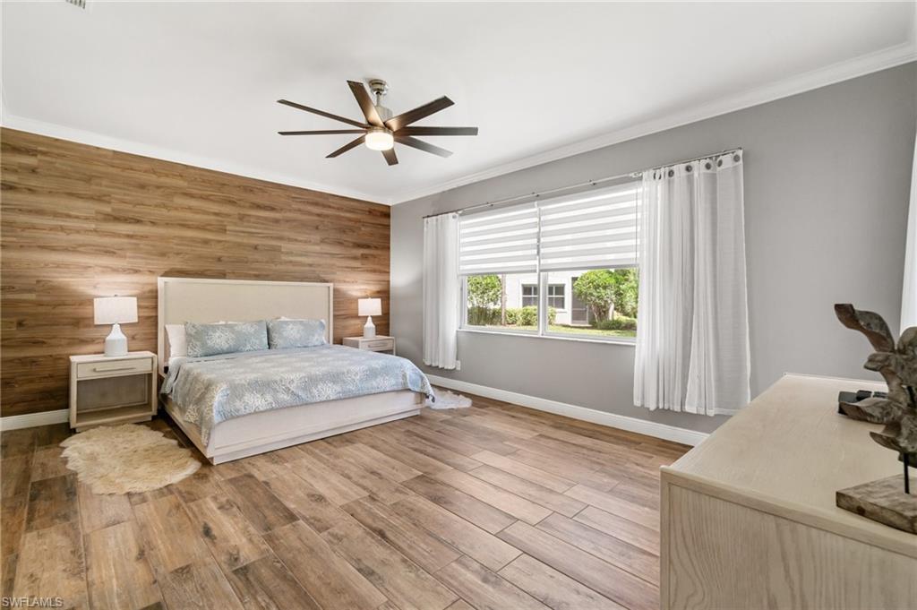 11000 Carrara Court, Unit 102 Bonita Springs, FL 34135 - Photo 12 of 31 a bedroom with a bed and window