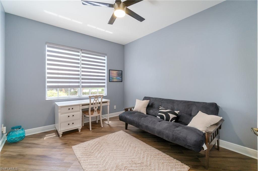 11000 Carrara Court, Unit 102 Bonita Springs, FL 34135 - Photo 21 of 31 a living room with furniture and a window