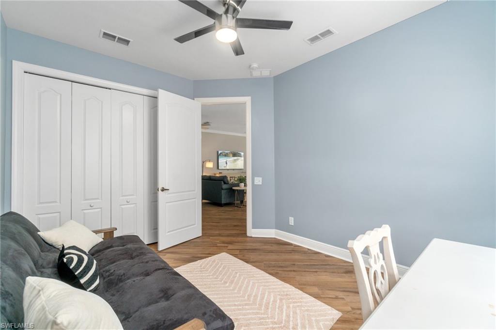 11000 Carrara Court, Unit 102 Bonita Springs, FL 34135 - Photo 22 of 31 a living room with furniture and a window