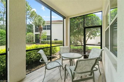 a view of an outdoor dining space with furniture and garden