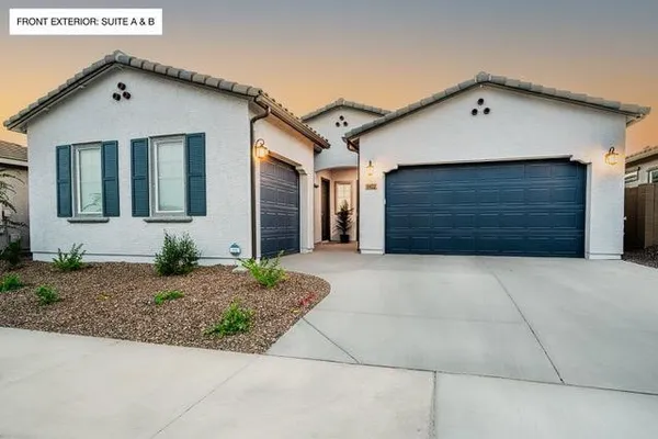 a front view of a house with a garage